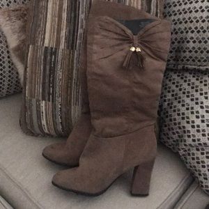Woman’s heeled suede boots